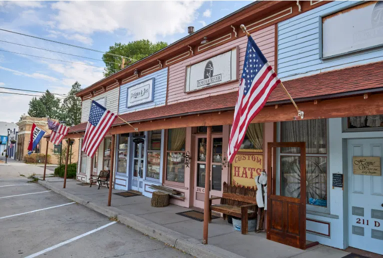 Historic downtown Elizabeth, Colorado storefronts with American flags