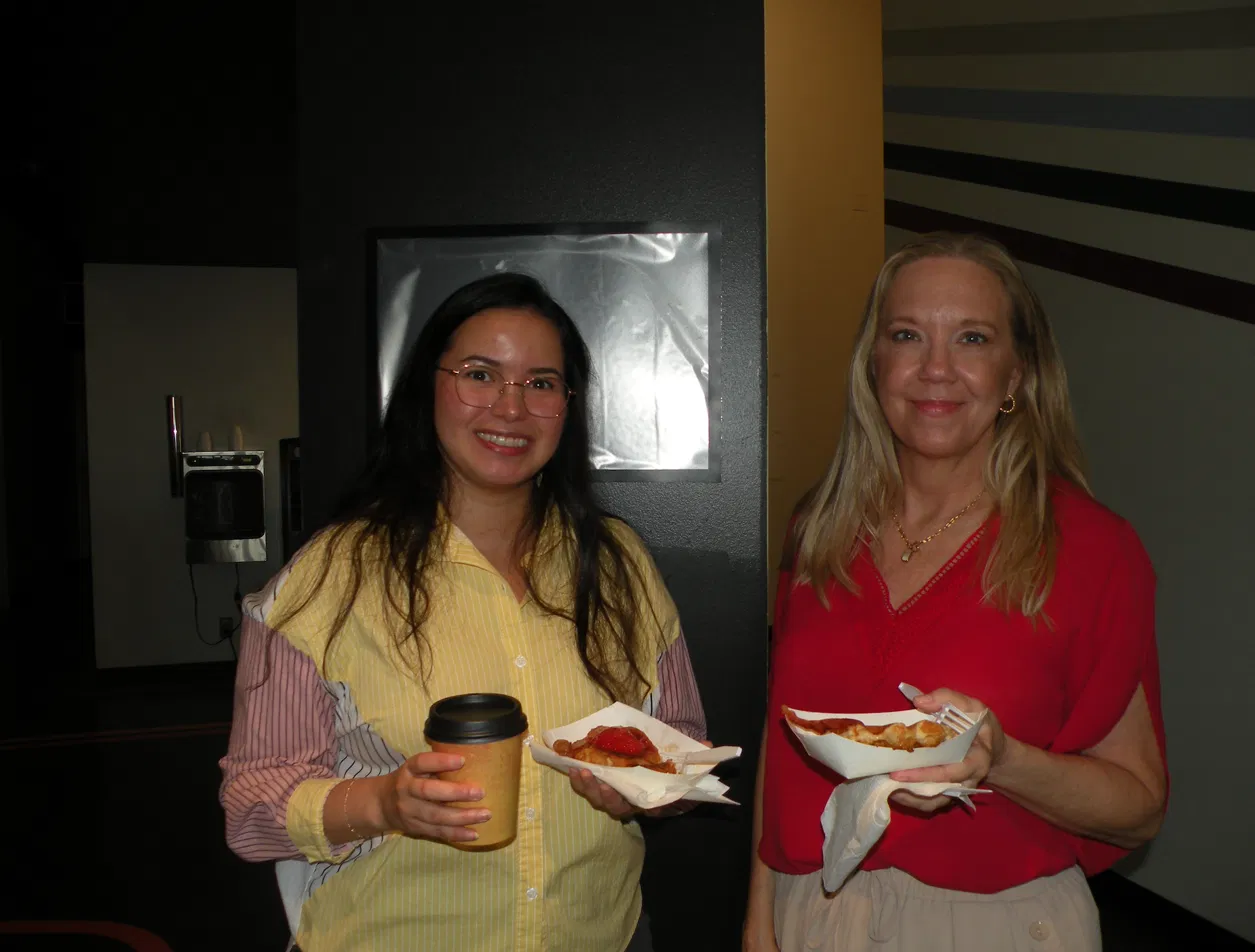 Guests enjoying fresh Belgian waffles and coffee at a Tom's Waffles fundraiser event in Denver