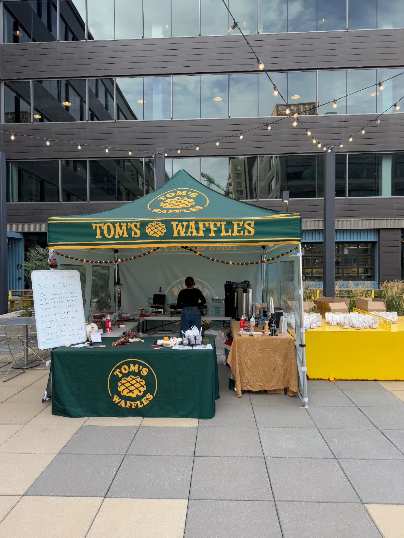 The Tom's Waffles tent set up on an office plaza