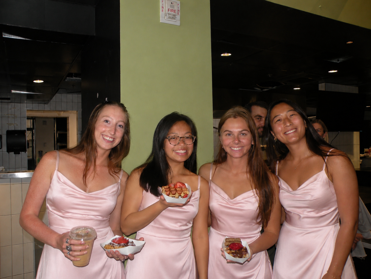 Bridesmaids enjoying fresh Belgian waffles and espresso at a Tom's Waffles wedding breakfast in Denver